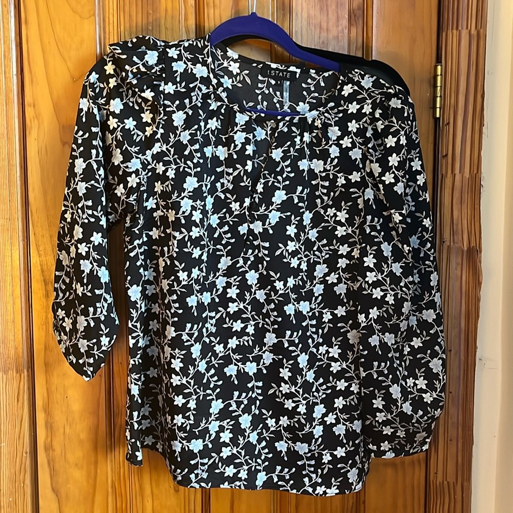 Very good condition blouse. Peep v neck with buttons, but not too low cut.